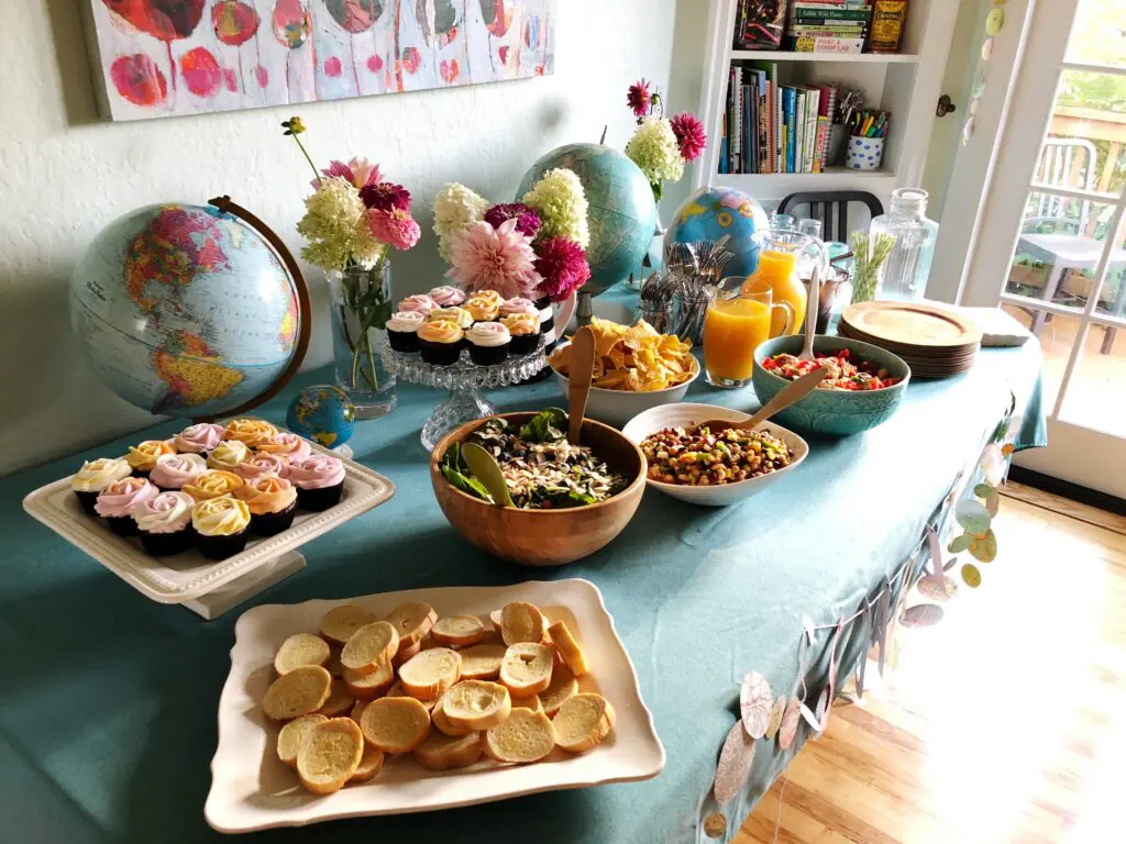 Adoption Buffet Table with Cupcakes, Globes & Flowers