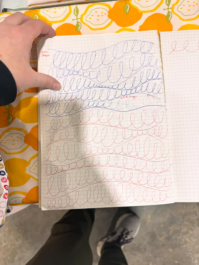 Quilting Loop Practice on Graph Paper with Fabric Background