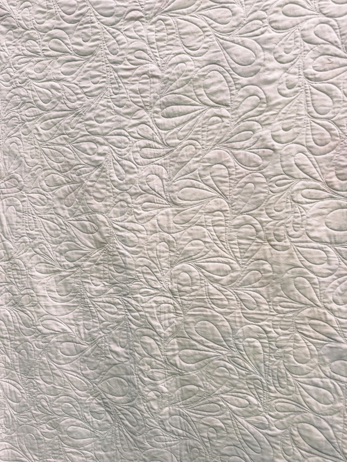 Learning Quilting White Quilt with Feathered Stitching