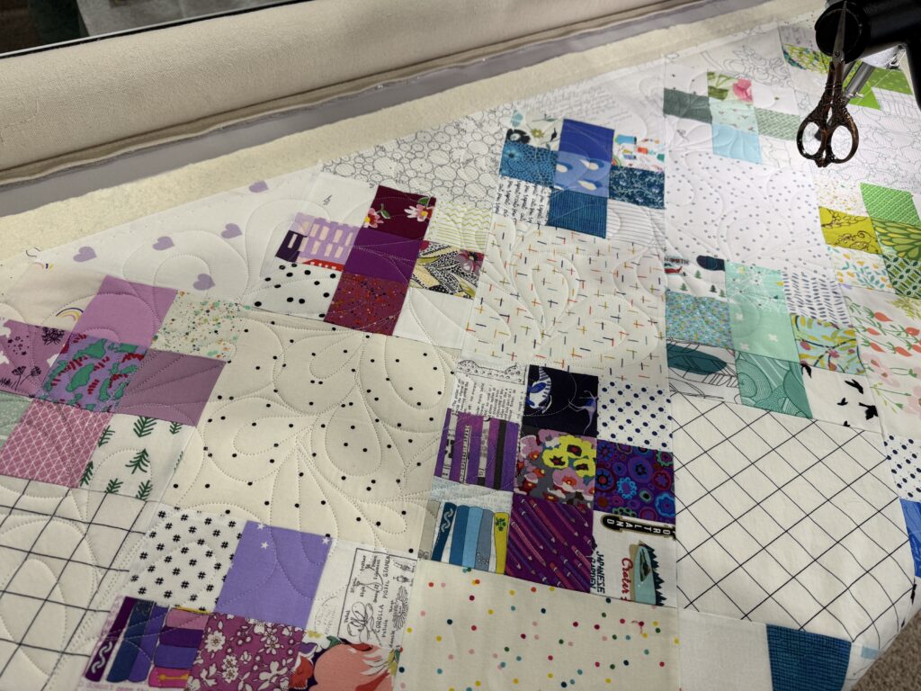 Crosses on Point Quilt on Longarm Frame with Machine Quilting